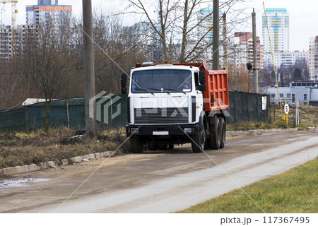 Heavy Duty truck with white cabin and a red body 117367495