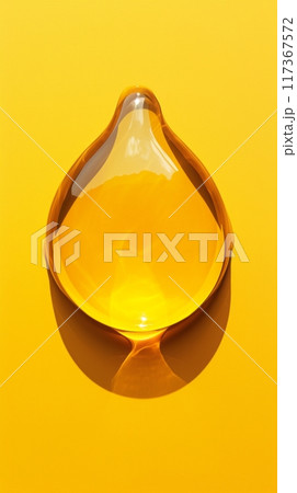 Macro photography close up of yellow liquid drops oil on a white background 117367572