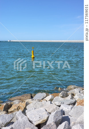 Sea breakwater and rock embankment. Sea breakwater and rock embankment. 117369031