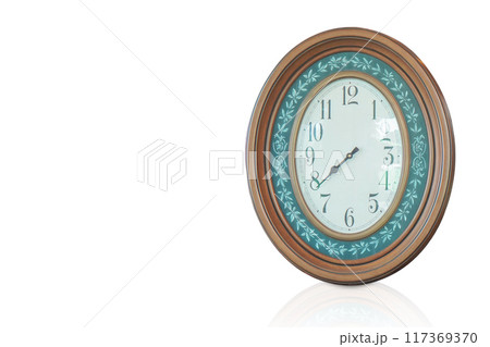 inside view wooden brown and green oval wall clock placed on a white background, object, decor, decoration, antique, ancient, copy space inside view wooden brown and green oval wall clock placed on a white background, object, decor, decoration, antique, ancient, copy space 117369370