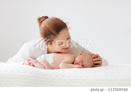 Young mother with newborn baby. Young mother with newborn baby. 117369598