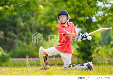 Kids playing cricket in summer park Kids playing cricket in summer park 117369669