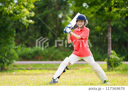 Kids playing cricket in summer park Kids playing cricket in summer park 117369670