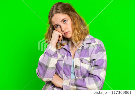 Woman tired bored expression, exhausted of tedious story, not interested in communication talk 117369861