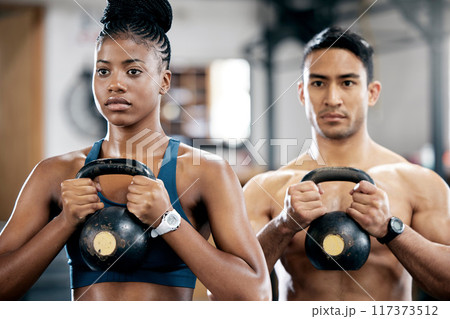 Fitness, kettlebell or couple of friends at gym strength training, exercise or workout at gym together. Team partnership, teamwork or healthy sports athletes with power, motivation or focus at gym 117373512