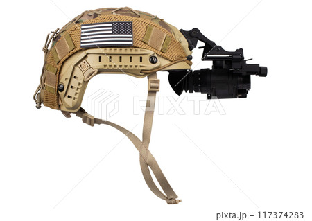 Night vision monocular on army helmet. 117374283