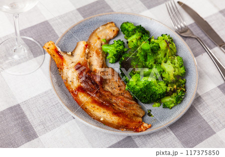 Roasted delicious pork belly with garnished of fresh broccoli 117375850