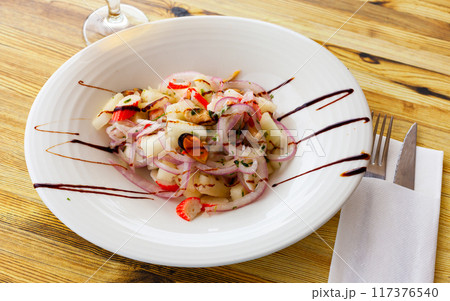 Salad with melon, mussels and crab sticks 117376540