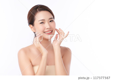 Beautiful young asian woman with clean fresh skin on white background, Face care, Facial treatment, Cosmetology, beauty and spa, Asian women portrait. Beautiful young asian woman with clean fresh skin on white background, Face care, Facial treatment, Cosmetology, beauty and spa, Asian women portrait. 117377387