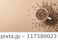 White to-go coffee cup placed on a bed of roasted coffee beans, highlighting the freshness and abundance of coffee.. 117380023