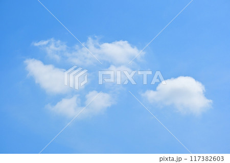 beautiful blue sky and white fluffy group of clouds with sunrise in the morning, natural background 117382603