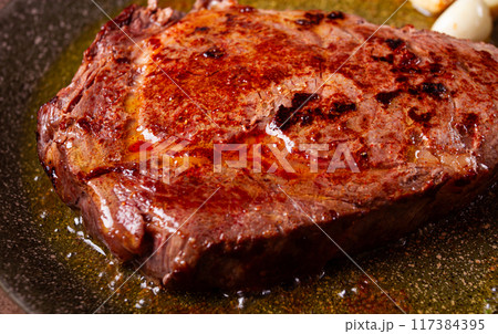 fried steak, beef steak, rib eye steak, in a frying pan, top view, no people 117384395