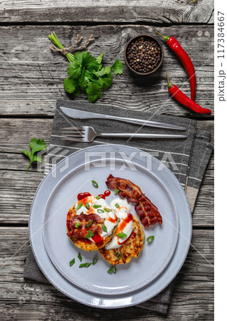 tasty cheese sweet corn pancakes with fried bacon 117384667
