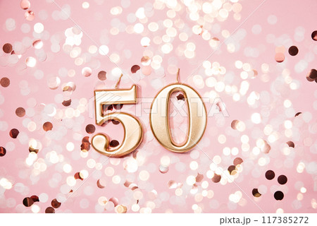 Number 50 fifty golden celebration birthday candle on Festive Background. Ten years birthday. concept of celebrating birthday, anniversary, important date, holiday Number 50 fifty golden celebration birthday candle on Festive Background. Ten years birthday. concept of celebrating birthday, anniversary, important date, holiday 117385272