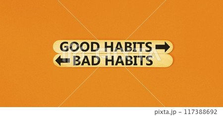 Good or bad habits symbol. Concept word Good habits Bad habits on beautiful wooden stick. Beautiful orange table orange background. Business good or bad habits concept. Copy space. 117388692