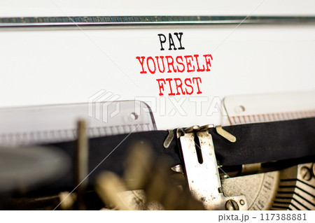 Pay yourself first symbol. Concept words Pay yourself first typed on beautiful old retro typewriter. Beautiful white paper background. Business and pay yourself first concept. Copy space. Pay yourself first symbol. Concept words Pay yourself first typed on beautiful old retro typewriter. Beautiful white paper background. Business and pay yourself first concept. Copy space. 117388881