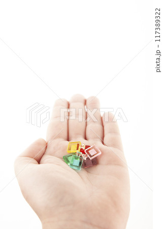 image of miniature glass bottle hand white background 117389322