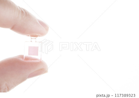 image of miniature glass bottle hand white background image of miniature glass bottle hand white background 117389323
