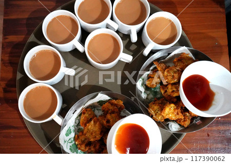 Milk Tea with Vegetable snacks and Ketchup Milk Tea with Vegetable snacks and Ketchup 117390062