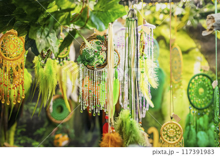 Vibrant decorations with beads and feathers dangle amidst greenery. St. Patrick's Day celebrations 117391983
