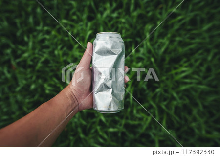 Recycle concept, plastic water bottles on the lawn 117392330