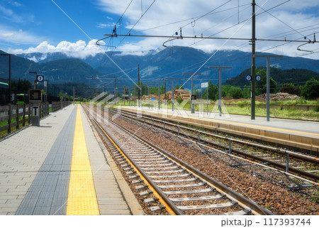 Railway station in alpine mountains on summer sunny day 117393744