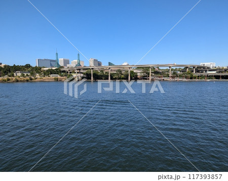 Portland, Oregon, USA - 07.10.2024: View of Portland and the city's transportation hubs across the Willamette River. 117393857