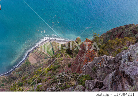 View of the ocean and coastline from the glass-floored Cabo Girao lookout on Madeira Island 117394211