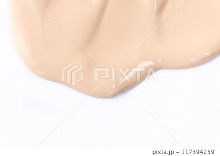Flow foundation on a white background, art in cosmetics. Flow foundation on a white background, art in cosmetics. 117394259