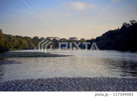 a river in the town at sunset 117394985