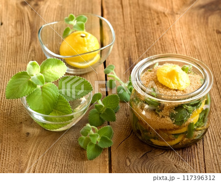 Homemade syrup made from fresh leaves of Plectranthus (Coleus) amboinicus, lemon slices and brown sugar. Homemade syrup made from fresh leaves of Plectranthus (Coleus) amboinicus, lemon slices and brown sugar. 117396312