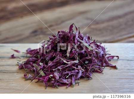 Dried flower petals of Echinacea purpurea, also known as purple coneflower, hedgehog coneflower or echinacea. Dried flower petals of Echinacea purpurea, also known as purple coneflower, hedgehog coneflower or echinacea. 117396316