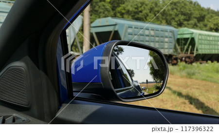 Land Vehicle Waiting For The Train Passing At Railway Crossing 117396322