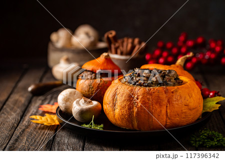 Tasty autumn stuffed pumpkin 117396342