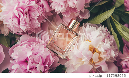 Perfume bottle with beautiful flowers. Floral background. Beauty concept. Flat lay, top view. 117398936