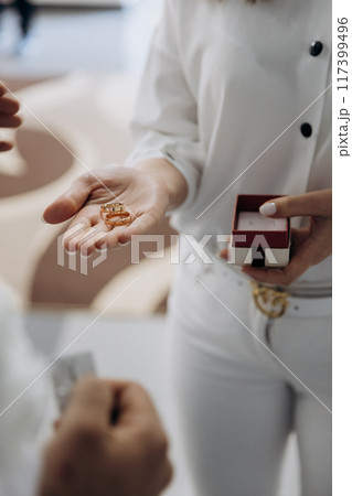 Exchanging wedding rings in a beautiful ceremony, symbolizing love, commitment, and union Exchanging wedding rings in a beautiful ceremony, symbolizing love, commitment, and union 117399496