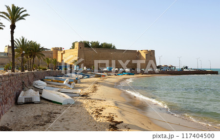 Town of Hammamet in Tunisia. View of ancient fort, coastline and fishing boats Town of Hammamet in Tunisia. View of ancient fort, coastline and fishing boats 117404500