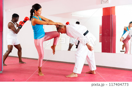 Self-defense lesson for women in gym. Power grabs and strikes Self-defense lesson for women in gym. Power grabs and strikes 117404773