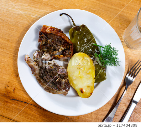 Fried fatty and juicy lamb and vegetable side dish of potato and bell pepper Fried fatty and juicy lamb and vegetable side dish of potato and bell pepper 117404809