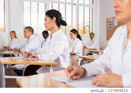 Confident asian female doctor listening refresher course 117404810