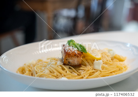Salmon Fettuccine with cheese served on plate 117406532