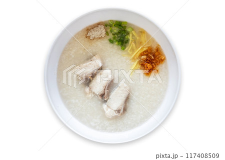 Sea bass congee is eaten with side dishes such as ginger, spring onion, and fried garlic. It is a healthy food. Sea bass congee is eaten with side dishes such as ginger, spring onion, and fried garlic. It is a healthy food. 117408509