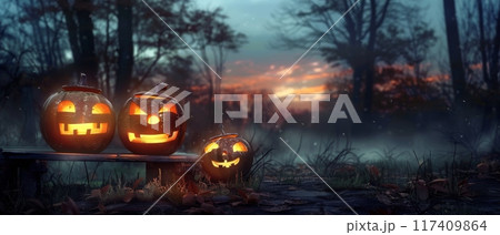 Glowing Jack-o'-Lanterns in Forest at Sunset 117409864