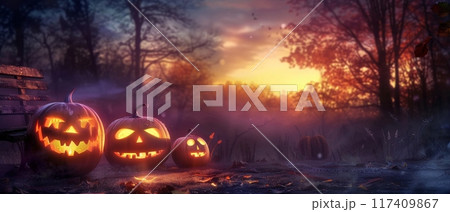 Glowing Jack-o'-Lanterns in Forest at Sunset 117409867