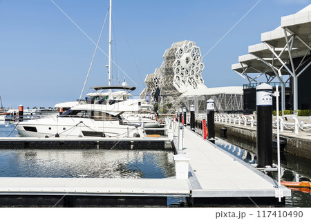 View of Yacht Marina at Glory Pier of Kaohsiung Port, Taiwan. with the Kaohsiung Music Center building. 117410490