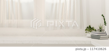 A copy space on a white table against the window with sheer curtains in a minimalist white room. A copy space on a white table against the window with sheer curtains in a minimalist white room. 117410626