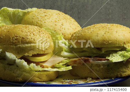 American hamburgers with sesame seeds American hamburgers with sesame seeds 117415400