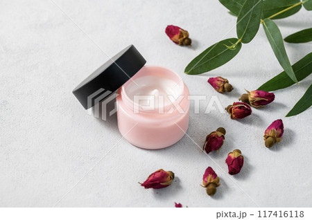 Face or body cream with rose  on a light background. The concept of care cosmetics 117416118