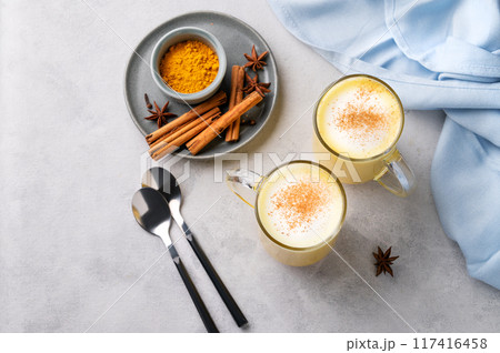 Turmeric golden milk latte with spices and honey. Detox, immunity boosting, anti-inflammatory Turmeric golden milk latte with spices and honey. Detox, immunity boosting, anti-inflammatory 117416458