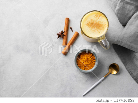 Turmeric golden milk latte with spices and honey. Detox, immunity boosting, anti-inflammator 117416858